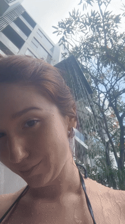 Woman enjoys early morning leisure time at Thailand resort