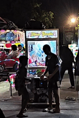 Children enjoy nighttime fair activities in Lhokseumawe, Indonesia