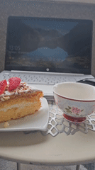 Decorated cake slice with strawberries documented in leisure setting