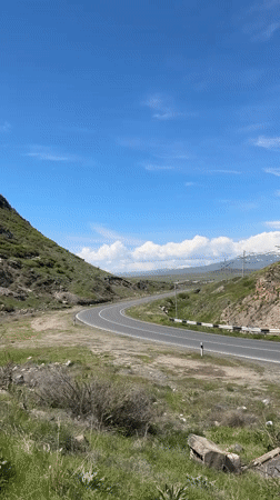 Morning traffic flows through scenic Armenian mountain roads