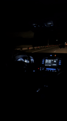 Nighttime highway drive recorded from car interior near Kaghsi