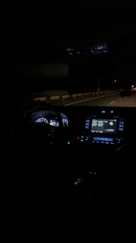 Nighttime highway drive recorded from car interior near Kaghsi