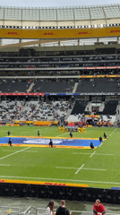Rugby match observed at Cape Town stadium during overcast afternoon