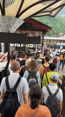 Tourist crowds and bus activity observed in Wulingyuan