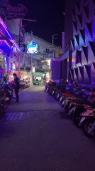 Nighttime scenes captured in Pattaya entertainment district alleyway