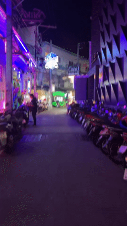 Nighttime scenes captured in Pattaya entertainment district alleyway
