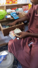 Shop money counting and ceiling fan captured simultaneously