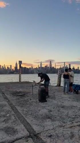 Sunset DJ session with NYC skyline views across the water