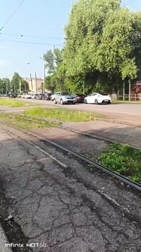 Late-night street scene near trolley tracks in Izhevsk