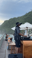 DJ performs morning oceanview set at Kuta beach club