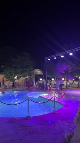 Night celebration around a lit pool in Sredets, Bulgaria