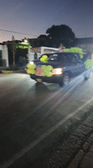 Decorated truck parade winds through Tinaquillo streets at dusk