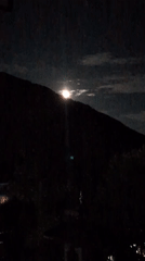 Full moon rises over the Dhauladhar range near McLeod Ganj