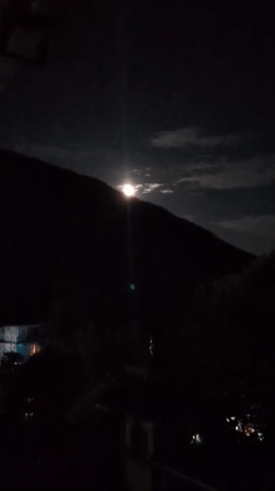Full moon rises over the Dhauladhar range near McLeod Ganj