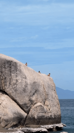 Beach day on Ko Pha-ngan: rock climbing, boats, and shoreside lounging