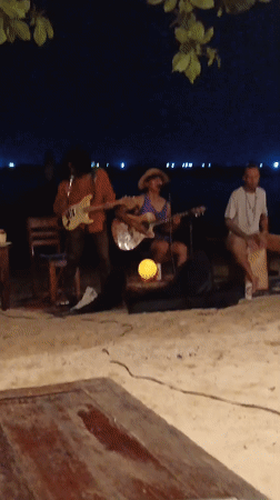 Night beach concert features local band in Thailand