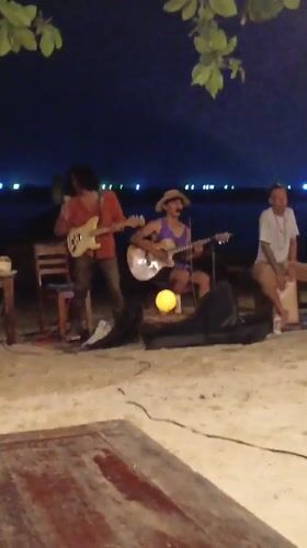 Night beach concert features local band in Thailand
