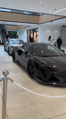 Luxury McLaren and Porsche displayed at shopping mall