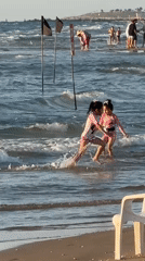 Families enjoy varied beach activities in Rishon LeZion afternoon