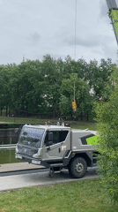 Crane operates at pond edge in Kazan