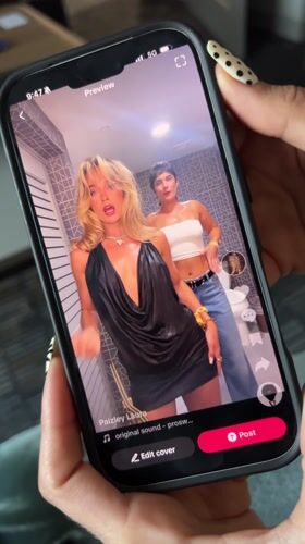 Person views TikTok dance video on smartphone in La Quinta