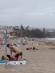 Beachgoers enjoy overcast day at Gran Canaria beach