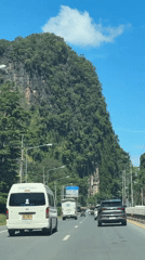 Car travels mountain road in Chong Pli, Thailand