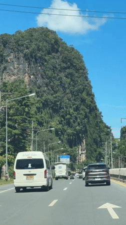 Car travels mountain road in Chong Pli, Thailand