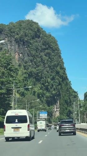 Car travels mountain road in Chong Pli, Thailand