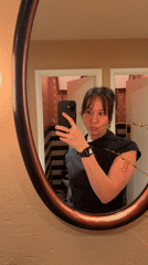 Woman takes bathroom mirror selfie in London