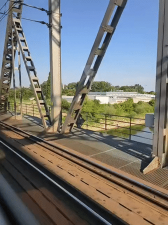 Rolling across a steel truss railway bridge in Tczew