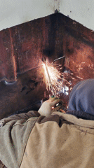 Welder observed working in protective gear in Russian village