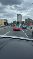 Driver observes traffic scene at Irish city intersection