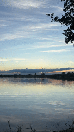 Sunset by a quiet lake in Bezliudivka, Ukraine