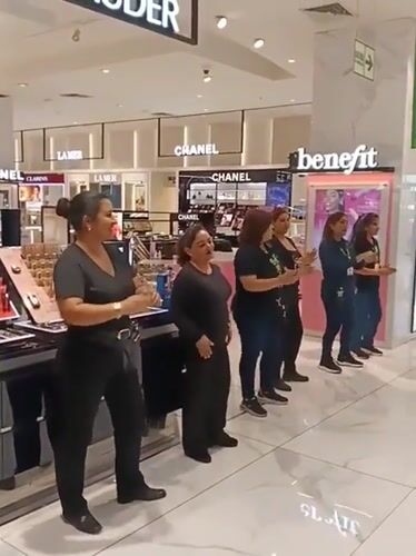 Dance group performs choreographed routine in Peru department store