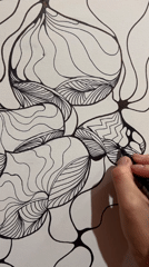 Artist creates flowing abstract line drawing in Russian village