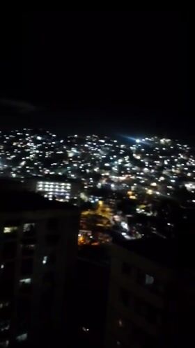 Nighttime cityscape views captured across Caracas hills