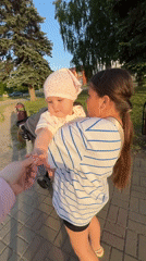 Family outing with baby documented in Novopokrovskaya park