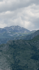 Driver navigates mountain highway near Klopot, Montenegro