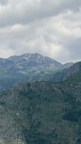Driver navigates mountain highway near Klopot, Montenegro