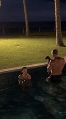 Couple photographed in nighttime pool session in Karangasem