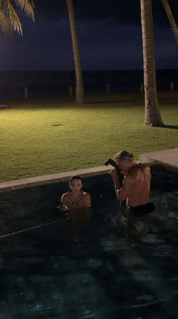 Couple photographed in nighttime pool session in Karangasem