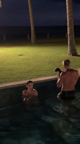 Couple photographed in nighttime pool session in Karangasem