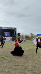 Traditional Peruvian dance performed by couples on grassy field