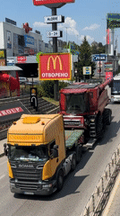 Combine harvester transport and Porsche spotted on Veliko Tarnovo road