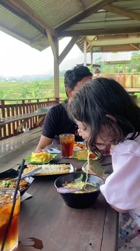 Family breakfast outing documented in rural Indonesia villages