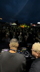 Outdoor DJ performance with crowd interaction in Saint Petersburg