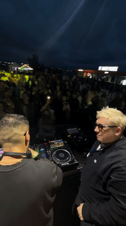 Outdoor DJ performance with crowd interaction in Saint Petersburg