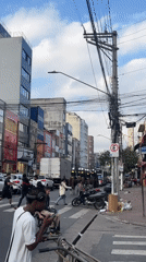 Urban street life captured with police, vendors, pedestrians