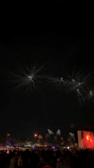 Nighttime outdoor concert with fireworks draws crowds in Indio
